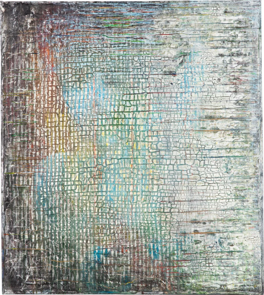 Cracked white-grey surface over a grid of turquoise, ochre and pink; the colour fades towards the right edge.