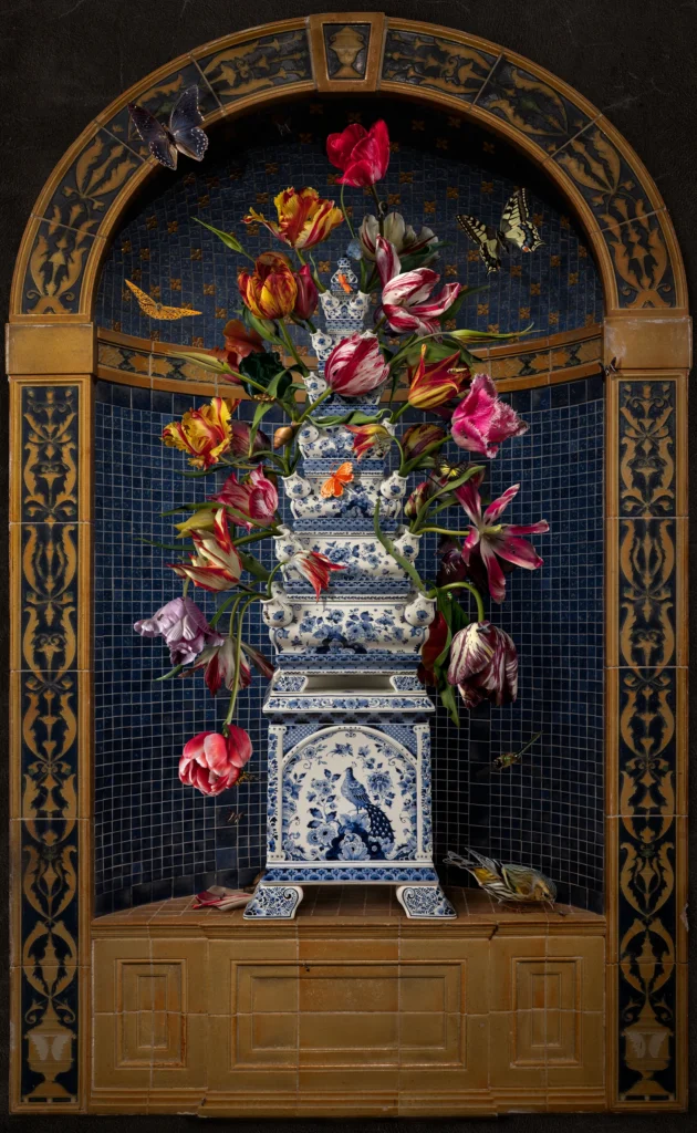 Tulips in a Delft blue flower pyramid set in a gilded, mosaic-lined niche.