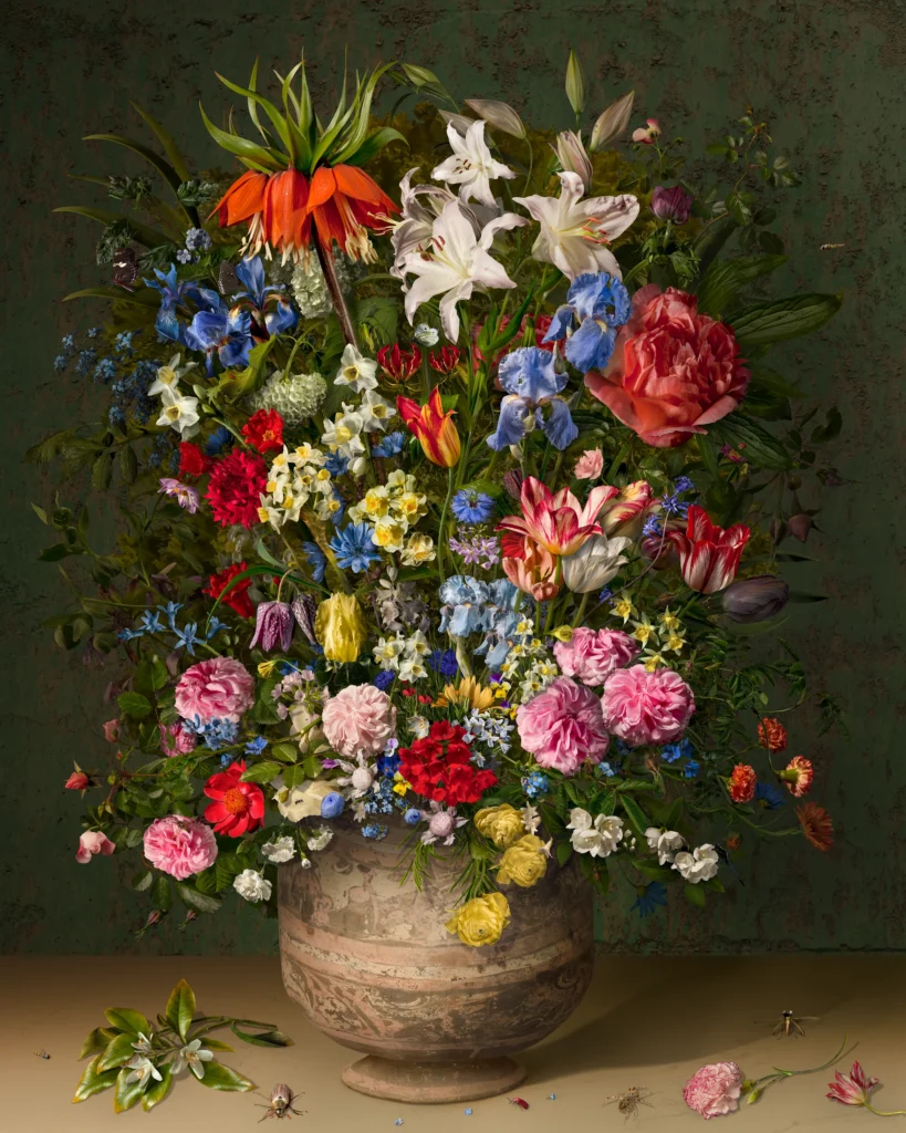 A tightly packed bouquet topped by an orange crown imperial in an earthenware pot against a gold ground, with petals on the ledge.