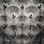Façade of the Cascade in Yerevan: rows of fan-shaped stone shells stacked in tiers, each with a small round basin at its base and thin streams of water running down the stonework.