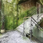 A stairwell with a glass-brick wall on the left, moss-green walls, a withered potted plant in the corner and a white staircase with rusted railings and glass balustrade panels.